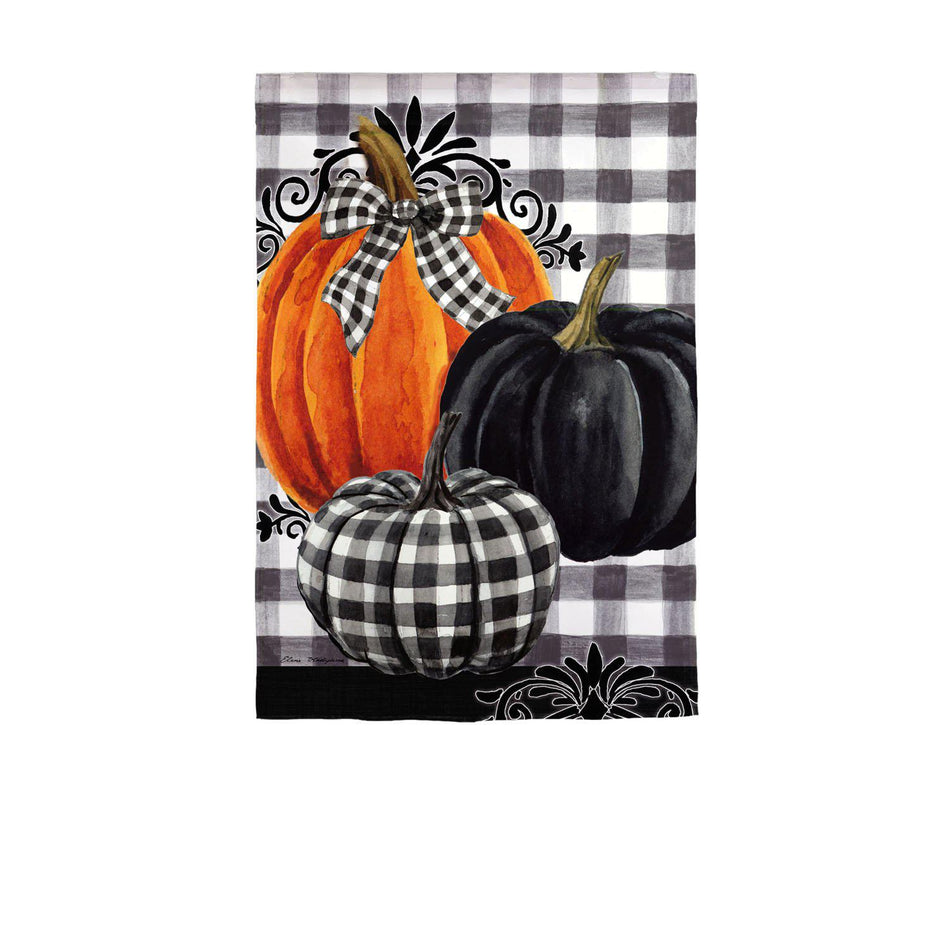 The Pumpkin Check garden flag features three pumpkins in black, orange, and checked colors on a black and white checkered background. 