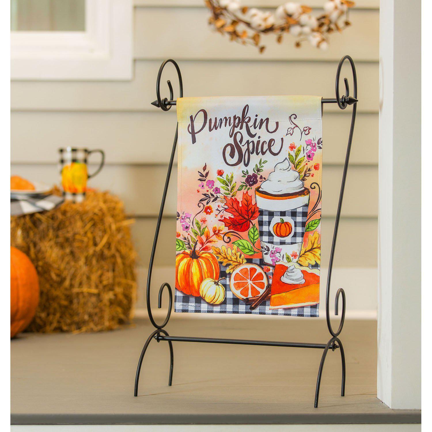 The Pumpkin Spice garden flag features a pumpkin spice drink on a autumn decorated table and the words "Pumpkin Spice". 