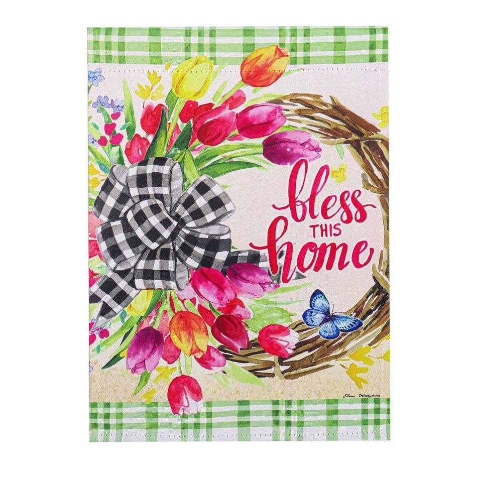 The Spring Florals Wreath garden flag features a grapevine wreath of tulips with a black and white checked bow and the words "Bless This Home". 