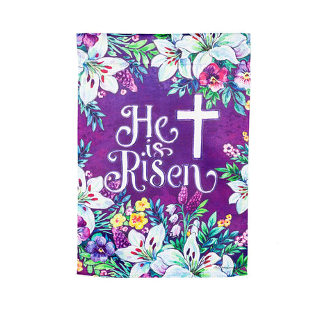 The Spring Flowers Easter Cross garden flag features spring flowers, and a cross on a purple background with the words" He Is Risen".