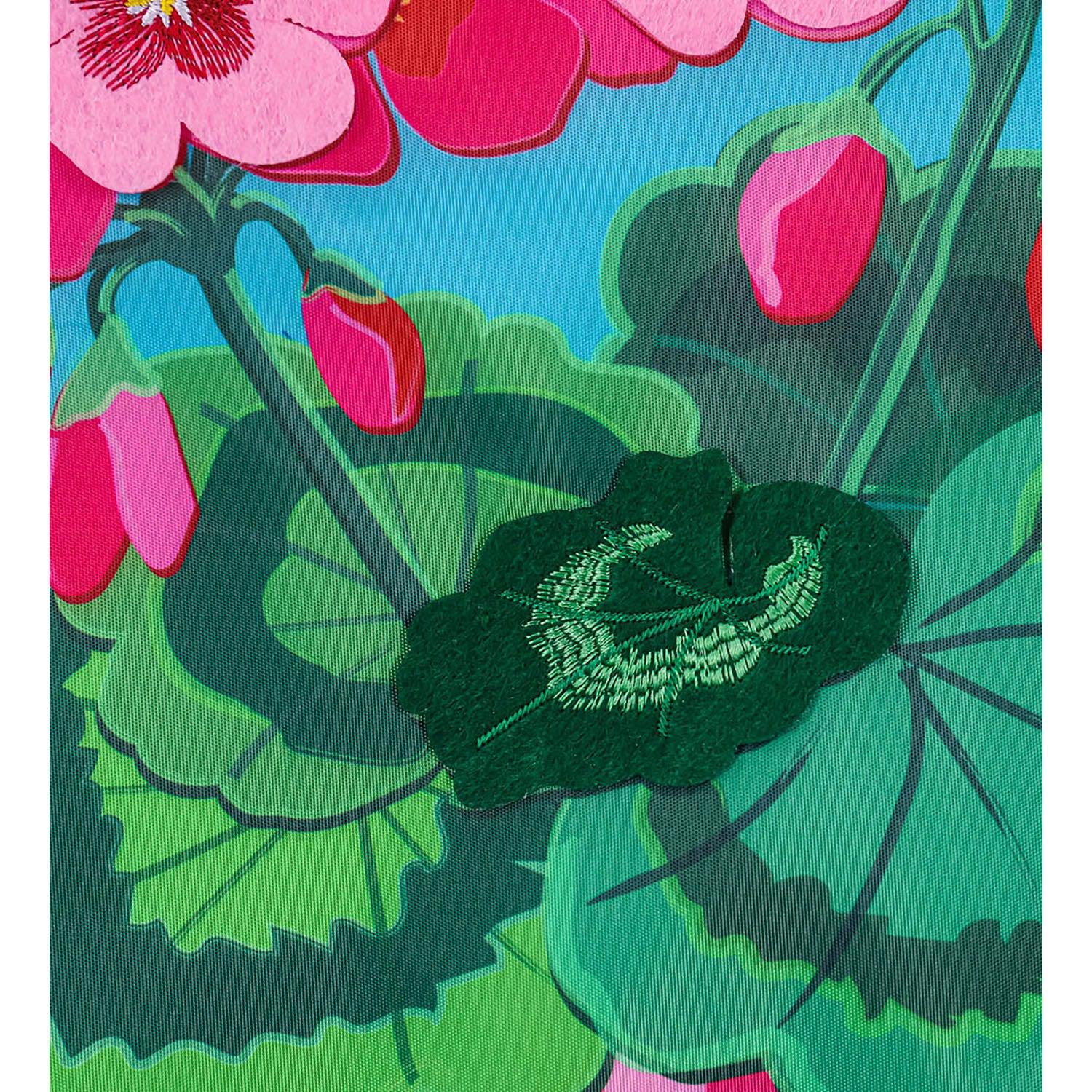 The Spring Geraniums garden flag features vivid pink geraniums with hot pink checked top and bottom borders and the word "Welcome" across the top.