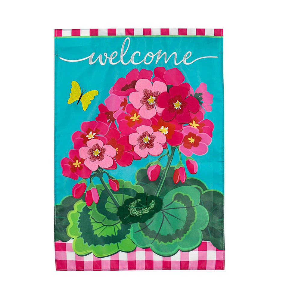 The Spring Geraniums garden flag features vivid pink geraniums with hot pink checked top and bottom borders and the word "Welcome" across the top.