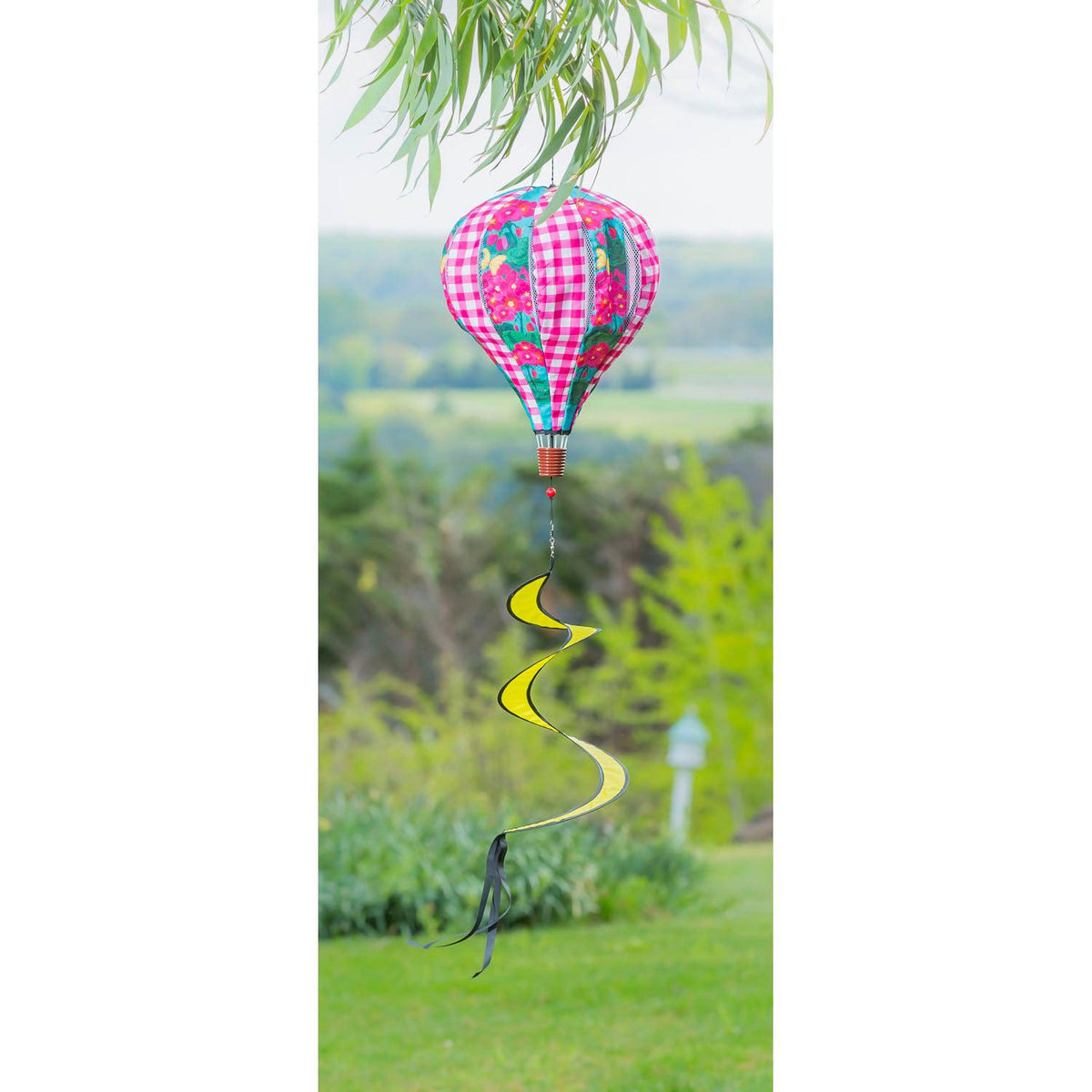 The Spring Geraniums Hanging Hot Air Balloon features alternating panels of bright pink geraniums and pink checks. 