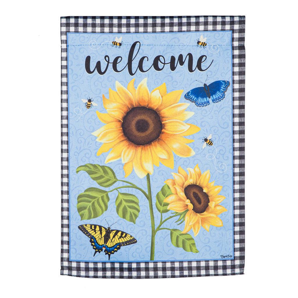 The Sunny Sunflower garden flag features bright yellow sunflowers over a sky blue background, a black checked border and the word "Welcome" across the top. 