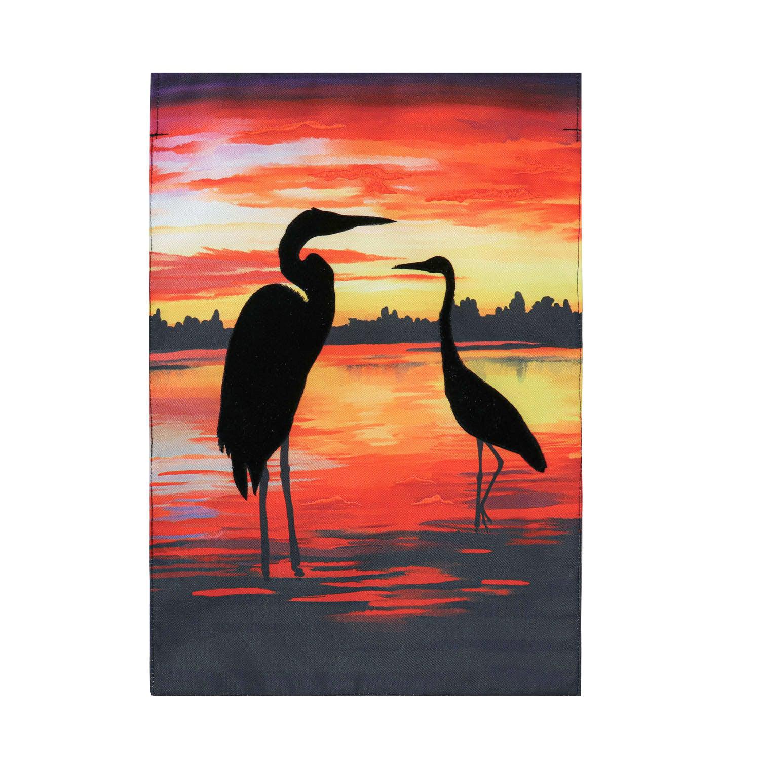 The Sunset Silhouette garden flag features a pair of cranes silhouetted against a beautiful sunset.