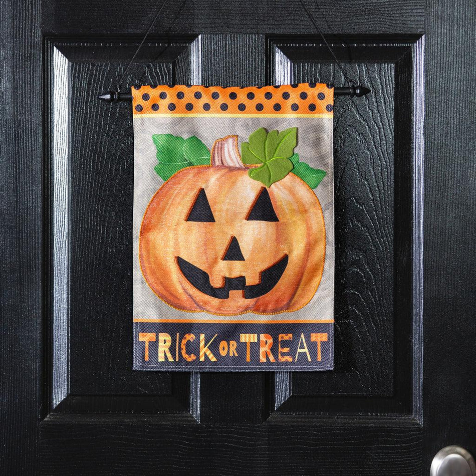 The Trick or Treat Pumpkin garden flag features a grinning jack-o-lantern and the words "Trick or Treat" across the bottom. 