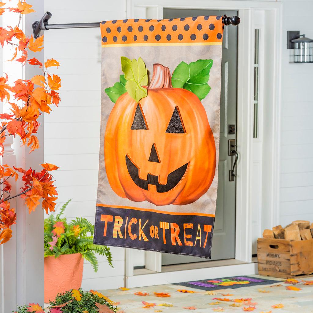 The Trick or Treat Pumpkin house banner features a grinning jack-o-lantern and the words "Trick or Treat" across the bottom.