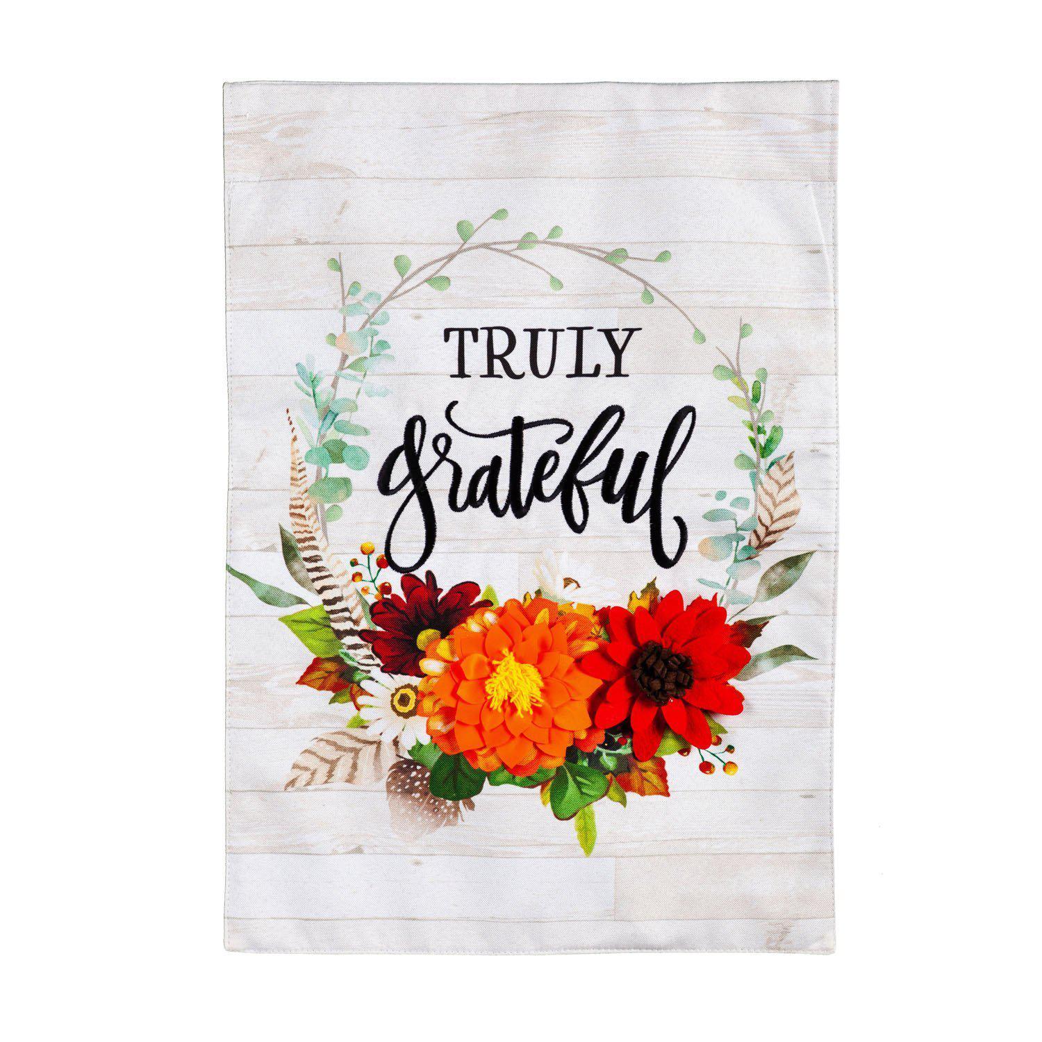 The Truly Grateful garden flag features a wreath of flowers and vines and the words "Truly Grateful" in the center. 