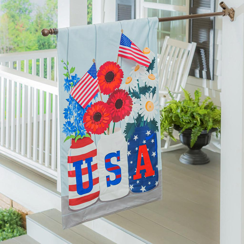 The USA Mason Jar house banner features three mason jars with the letters USA on the front, holding flags and red, white, and blue flowers. 