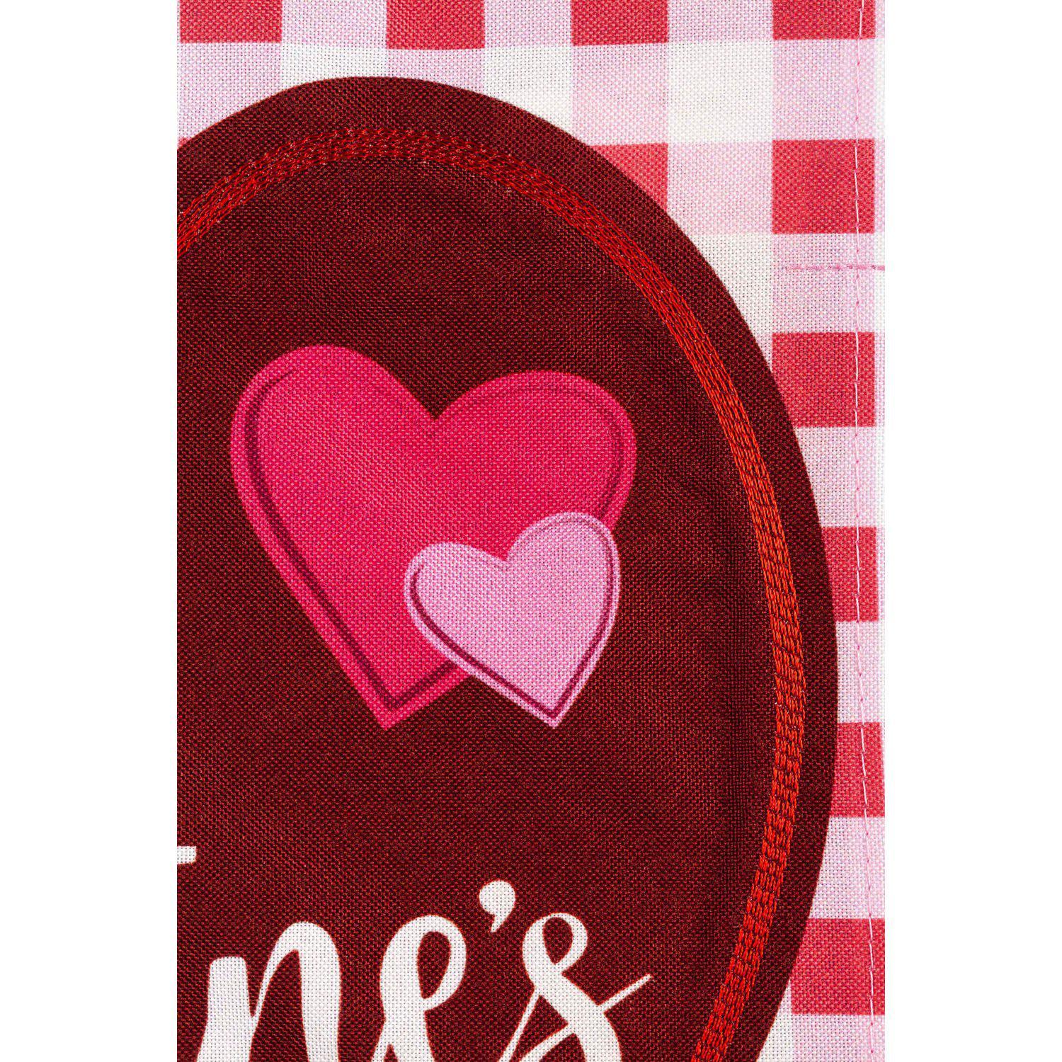 The Valentine Hearts and Checks garden flag features pink and red hearts on a checked background and the words "Happy Valentine's Day". 