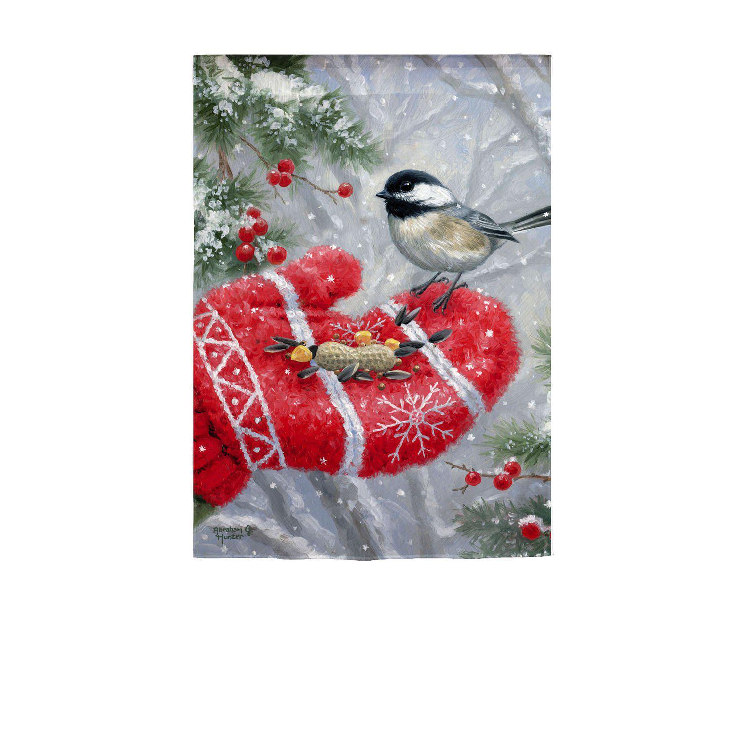 The Winter Encounter garden flag features a chickadee receiving a treat from a red mitten covered hand. 