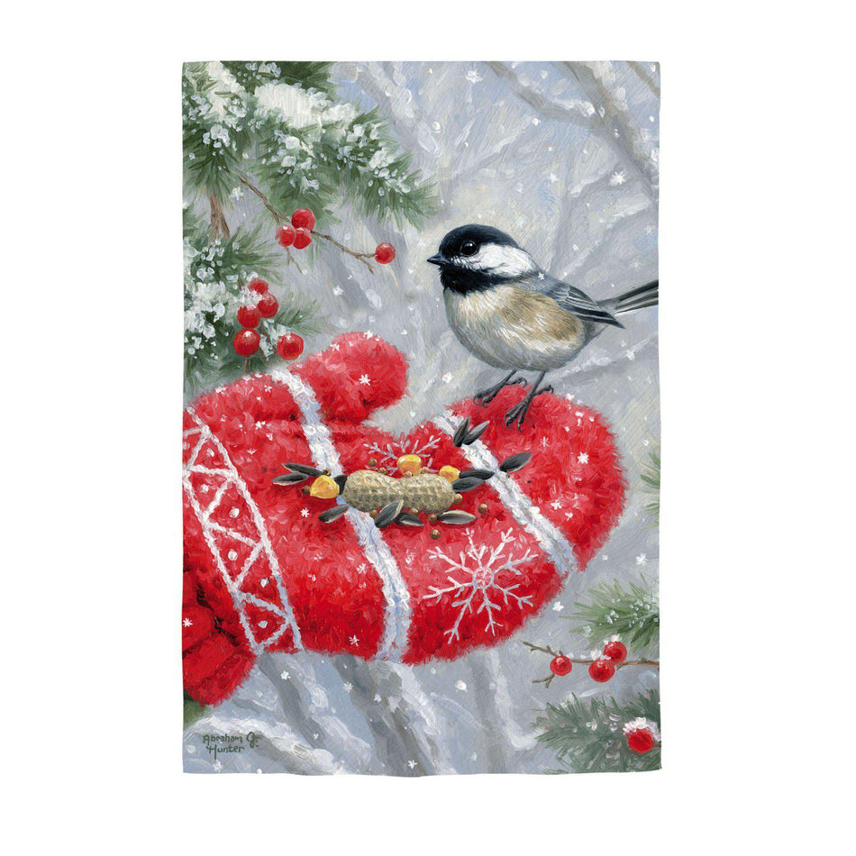 The Winter Encounter house banner features a chickadee receiving a treat from a red mitten covered hand. 