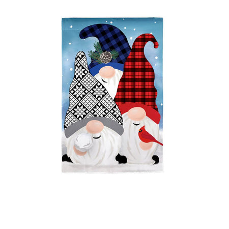 The Winter Gnome Friends garden flag features three gnomes with patterned hats and a cardinal along with snow falling in the background. 