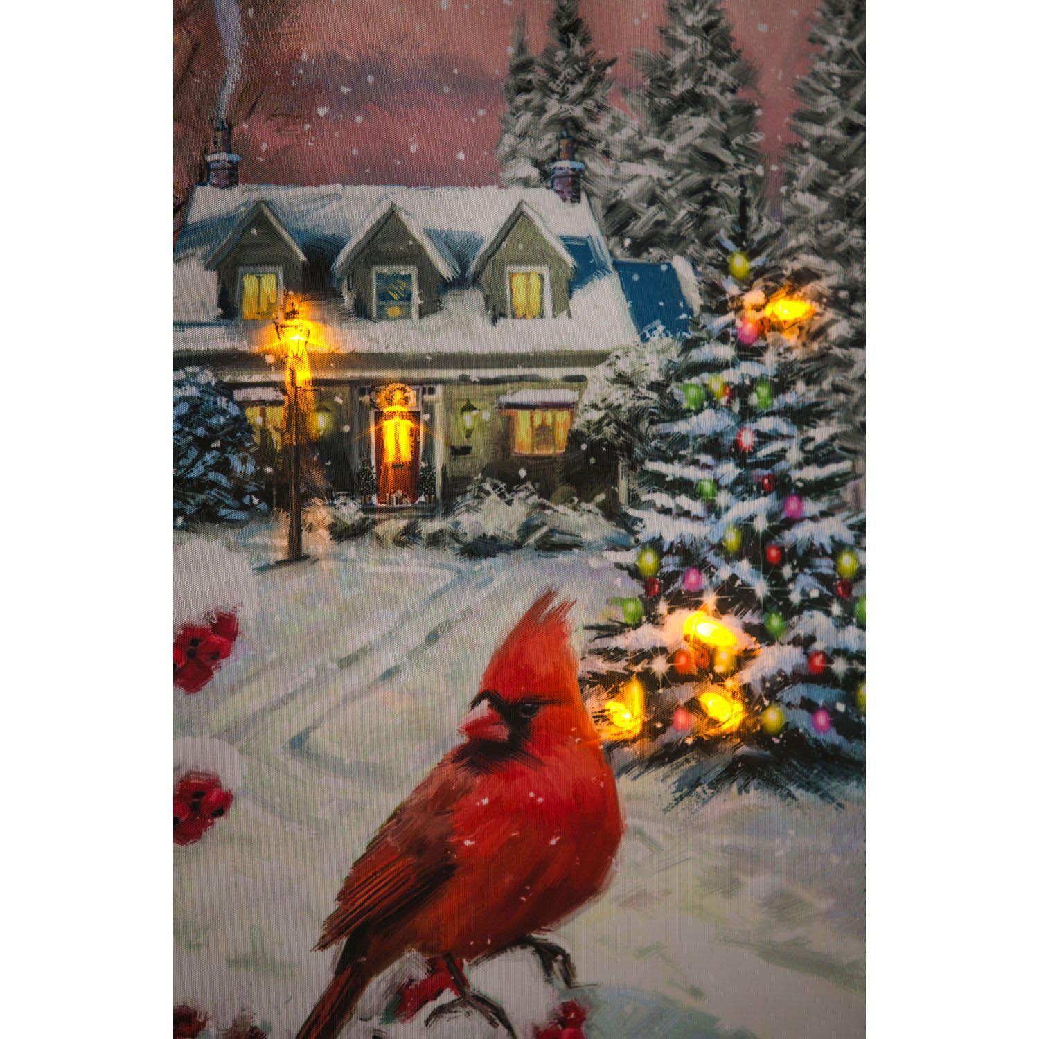 The Winter Perch Solar LED garden flag features a pair of cardinals sitting on snow covered branches with a cozy home in the background. 