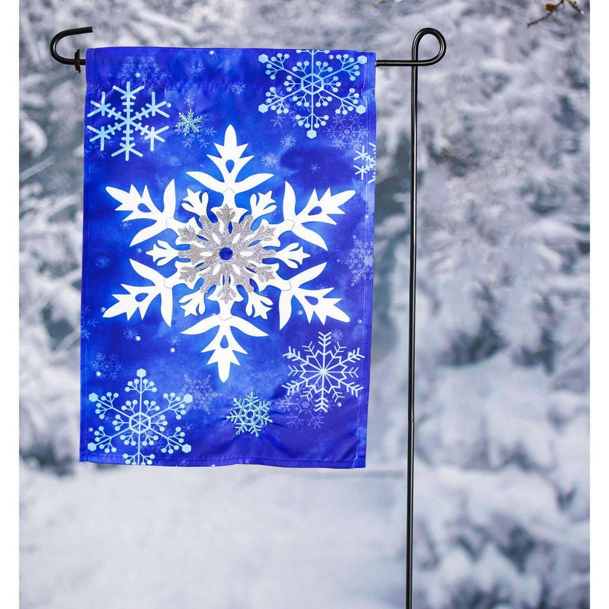 The Winter Snowflakes garden flag features white and silver snowflakes on a brilliant blue background.