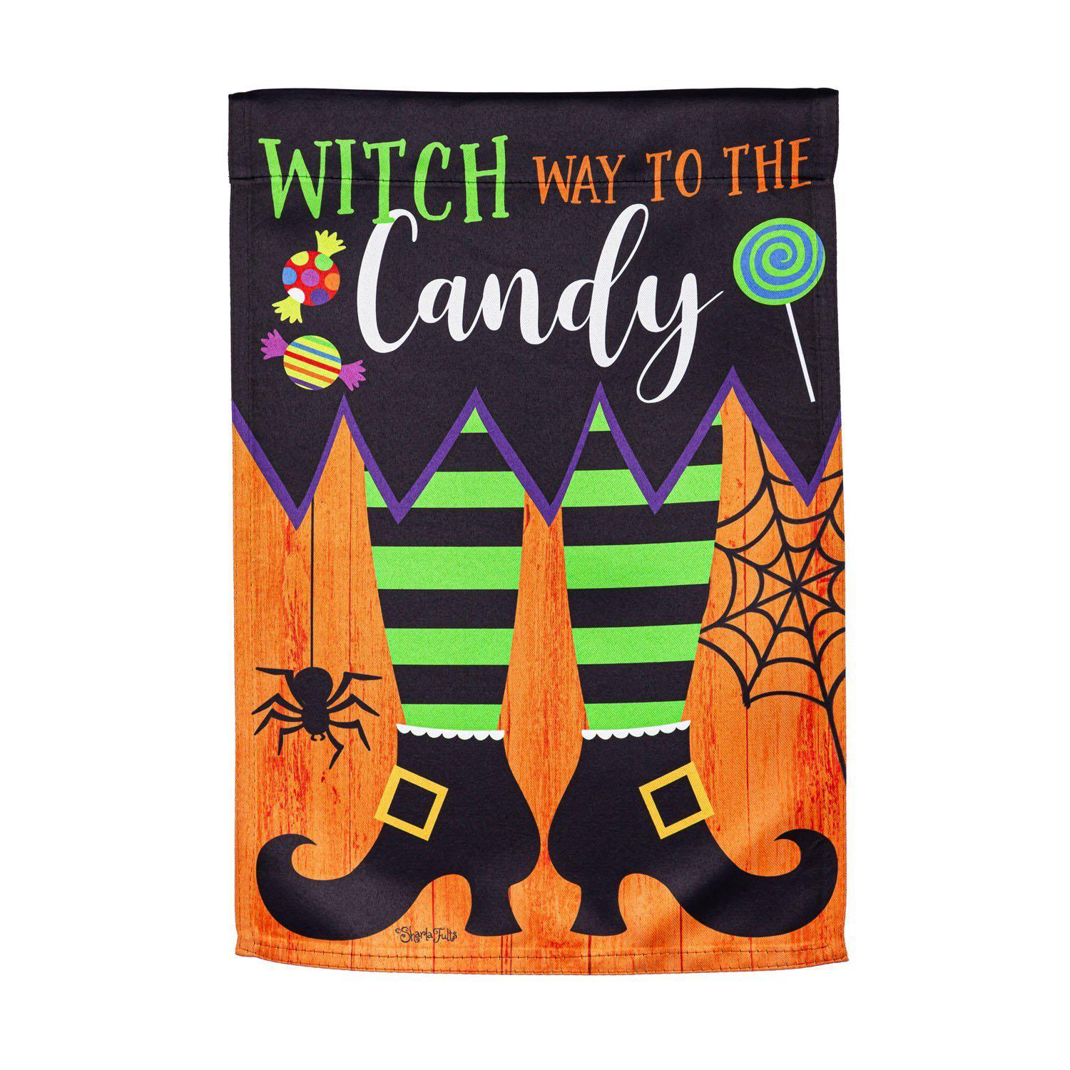 The Witch Way garden flag features a pair of witch feet and the words "Witch Way to the Candy". 